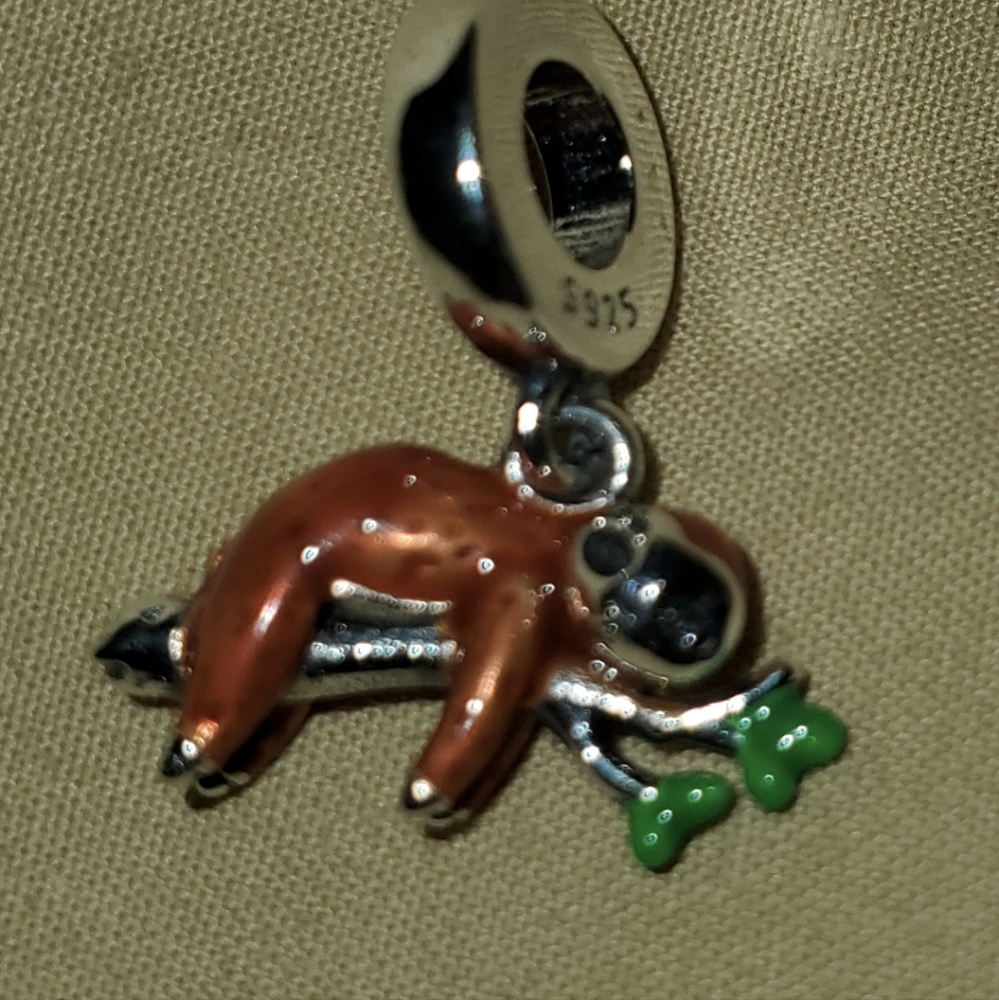 A sloth bead that fits Pandora bracelets